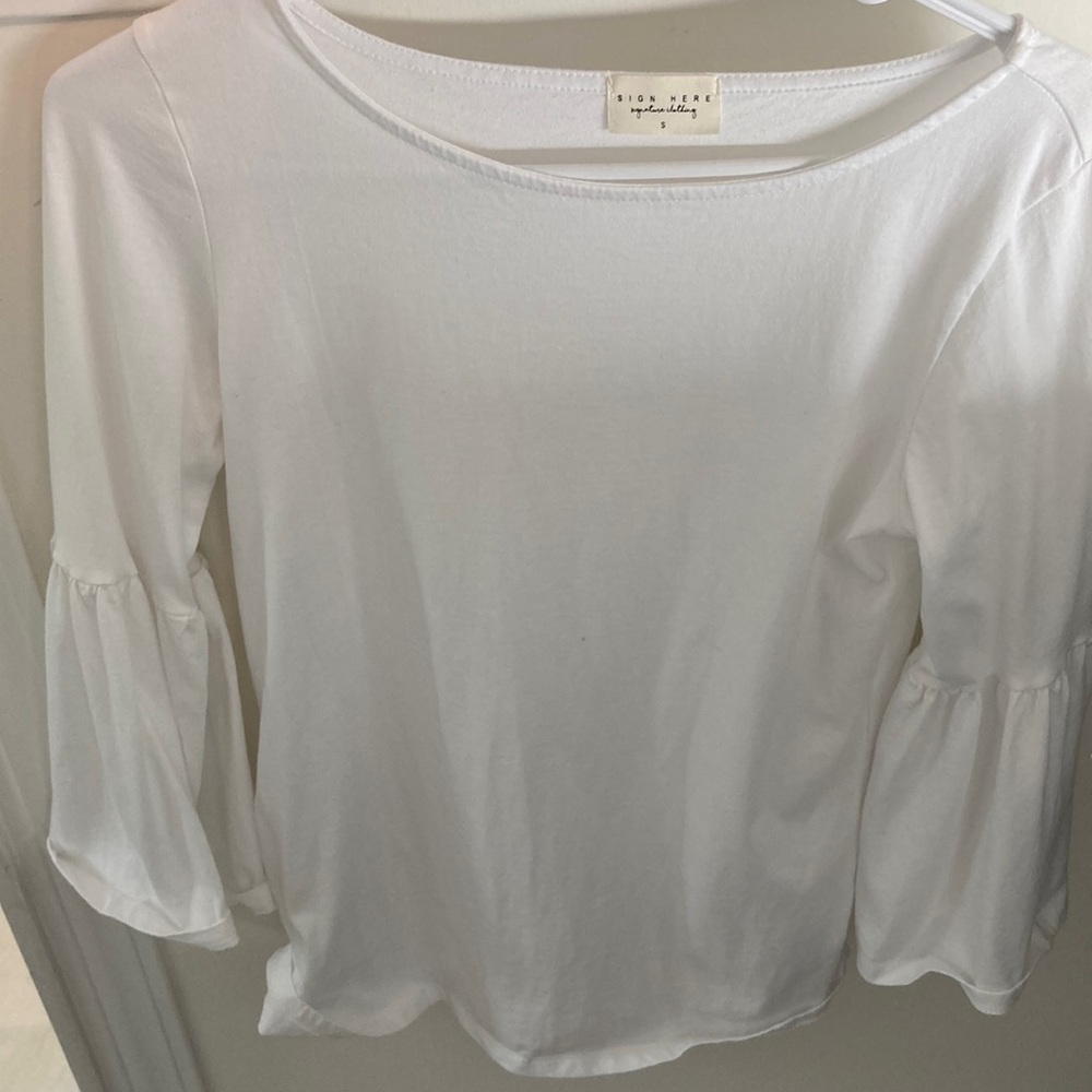 White sign here signature clothing shirt.